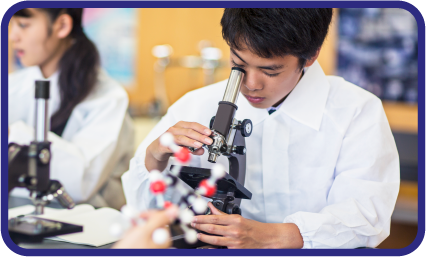 Boy looking at microscope